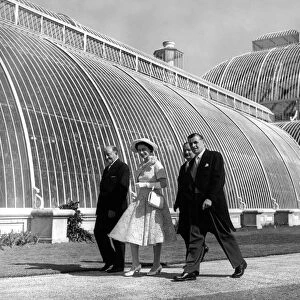 Queen Elizabeth II walking past the Palm House during her tour of Kew Gardens