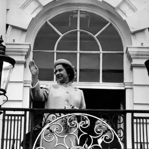 Queen Elizabeth II waves to the crowd from the balcony at Warrington Town Hall Queen Elizabeth II waves to the crowd from the balcony at Warrington Town Hall