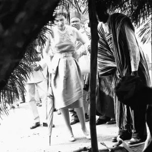 Queen Elizabeth looks in on one of the village huts during a visit to Hangha in Kenema Queen Elizabeth looks in on one of the village huts during a visit to Hangha in Kenema
