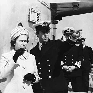 Queen Elizabeth and Prince Charles touring the warship HMS Norfolk the 6