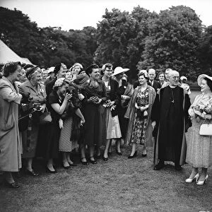 The Queen Mother in the gardens of Lambeth Palace 1955 with the Archbishop of