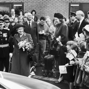 The Queen visits Manchester. Pictured here she waves to the crowd on her visit to The Queen visits Manchester. Pictured here she waves to the crowd on her visit to