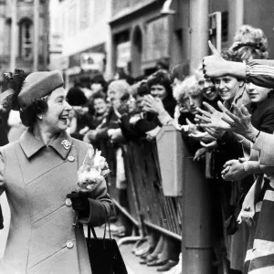 The Queen visits Manchester. The Queen laughs as she is greeted by the crowd The Queen visits Manchester. The Queen laughs as she is greeted by the crowd