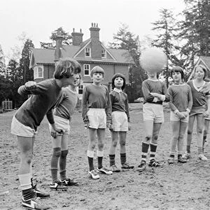 Queens Park Rangers footballer Don Masson coaching children to play football at the Our