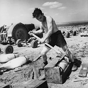 R. A. F armourers at work in Tunisia, preparing airfield. 5th May 1943