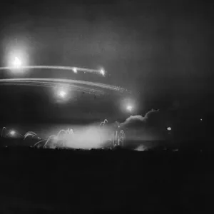 R. A. F. bombs falling near Caen prior to a Canadian assault on German lines R. A. F. bombs falling near Caen prior to a Canadian assault on German lines