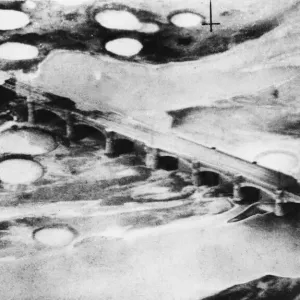 R. A. F. Kittyhawks attack railway bridge at Fano during the Second World War