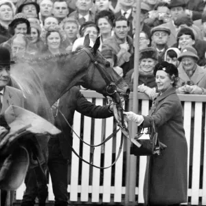 Racehorse owner The Duchess of Westminster leads smiling jockey Pat Taaffe on racehorse