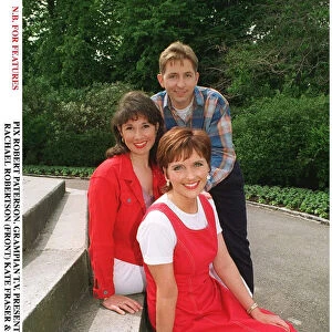 Rachael Robertson TV Presenter with Kate Fraser and Scott Brown sitting on concrete steps