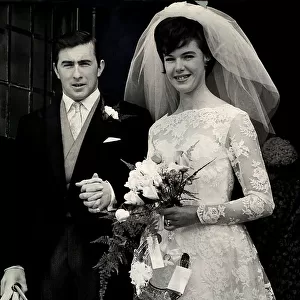 Racing driver Jackie Stewart with his bride Helen McGregor after their wedding ceremony