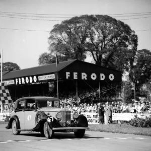 Racing at Goodwood, Richard Murdock crossing the finishing line in the celebrities race Racing at Goodwood, Richard Murdock crossing the finishing line in the celebrities race