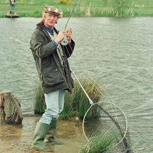Radio Disc Jockey Chris Tarrant enjoying a spot of fishing in his spare time