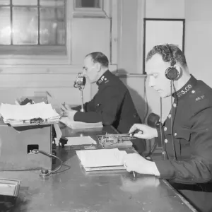 Radio and telegraph officers on duty in Scotland Yards information room