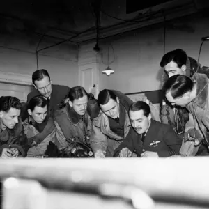 RAF air crew listen to the instructions of the Commanding officer during preparations for RAF air crew listen to the instructions of the Commanding officer during preparations for