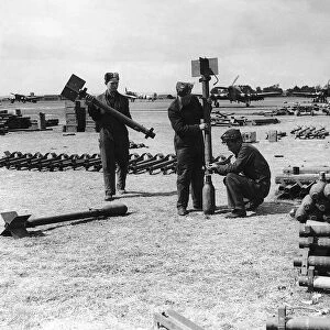 RAF armourers prepare rockets for Hawker Typhoon aircraft during WW2 1944
