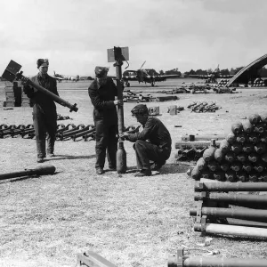 RAF armourers prepare rockets for Hawker Typhoon aircraft during WW2 1944 RAF armourers prepare rockets for Hawker Typhoon aircraft during WW2 1944