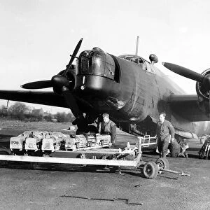 RAF ground crew load propaganda leaflets into bomb bay of a Vickers Wellington