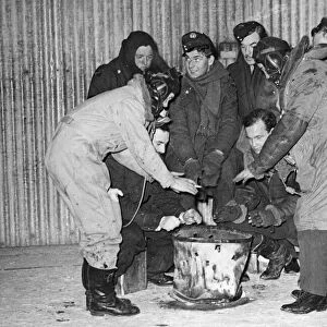 RAF men work in Arctic conditions in France. This picture was taken at night when