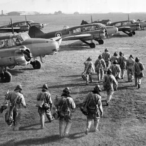 RAF pilots and crew make their way to their Avro Anson planes during World War Two RAF pilots and crew make their way to their Avro Anson planes during World War Two