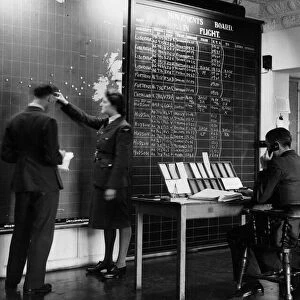 RAF and WaF personnel at work in the Operations Room of the Atlantic Ferry Service at