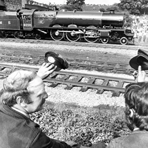 Railway enthusiasts Pete Reid from Ken and Dave Wescott from Derby salute the pass by of