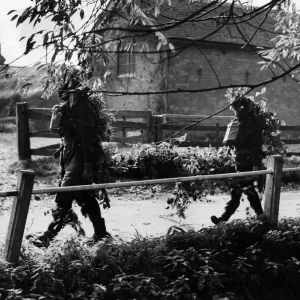 RAMC Stretcher bearers show how to camouflage themselves RAMC Stretcher bearers show how to camouflage themselves