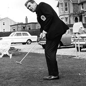 Rangers football manager John Prentice with golf club