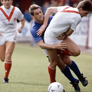 Rangers footballer Kevin Drinkell in a tangle with a player from Airdrieonians during