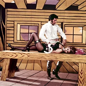 Raquel Welch and Tom Jones acting during a TV show television lying on a