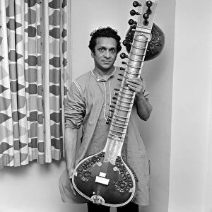 Ravi Shankar seen here holding his sitar June 1966