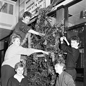 Rawthorpe High School pupils decorating the Christmas Tree in the entrance to St Luke