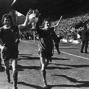 Ray Clemence and Larry Lloyd of Liverpool parade the League Championship trophy following Ray Clemence and Larry Lloyd of Liverpool parade the League Championship trophy following