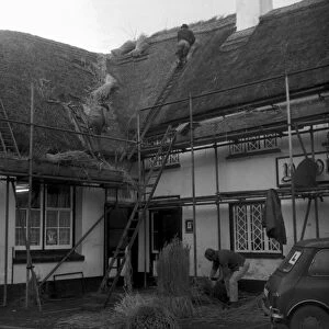 Re-thatching of the Manor Inn at Preston in November 1970