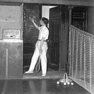 Real Tennis, player keeps score beside the court. Circa 1933