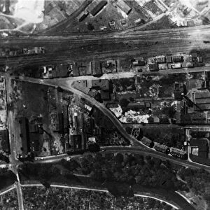 A reconnaissance photograph shows heavy damage in Karlsruhe after an R. A. F