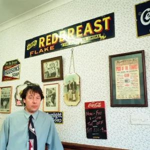 Redcar barber Mike Forbes with some of his collection of memorabilia in his shop Redcar barber Mike Forbes with some of his collection of memorabilia in his shop
