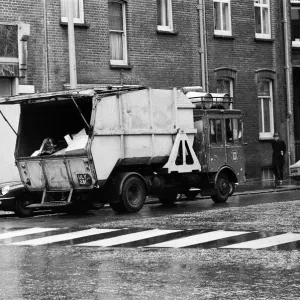 A refuse collector working on the Kings Road, London. 4th December 1970 A refuse collector working on the Kings Road, London. 4th December 1970