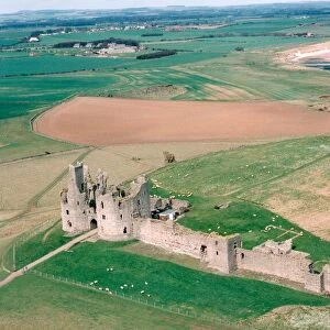 The remote and impressive ruins of Northumberlands Dunstanburgh Castle in July 1999