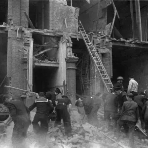 A rescue by the National Fire Service when a flying bomb crashed on flats at Nevern