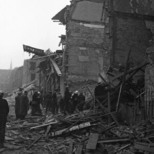 Rescue workers search the collapsed buildings of the Central London Ophthalmic Hospital