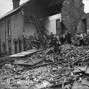 Rescue workers searching the rubble of a house in Aston, Birmingham