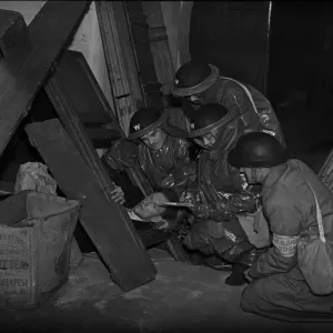 Rescuing a casualty. A series of realistic exercises were carried out at the A. R. P Rescuing a casualty. A series of realistic exercises were carried out at the A. R. P
