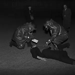 Rescuing a casualty. A series of realistic exercises were carried out at the A. R. P Rescuing a casualty. A series of realistic exercises were carried out at the A. R. P