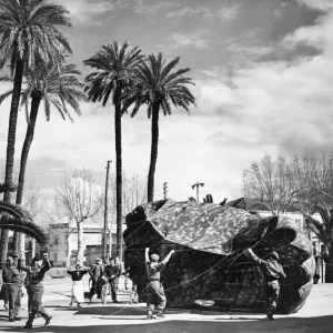 Retrieving an parachute in North Africa. 8th of April 1943 Retrieving an parachute in North Africa. 8th of April 1943