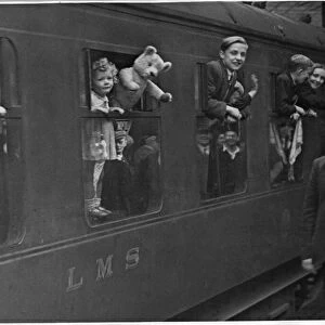 Returning evacuee children wave goodbye to Derby as their train moves out