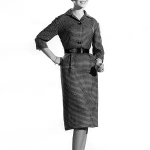 Reveille Fashion. Mannequin wearing a belted mid sleeve dress. January 1961 P006881