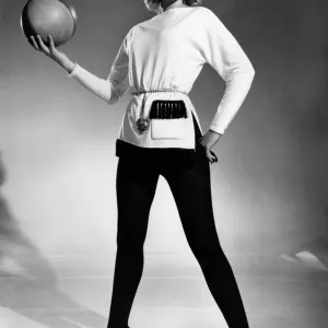 Reveille Fashions 1961. Mannequin wearing a belted sweater