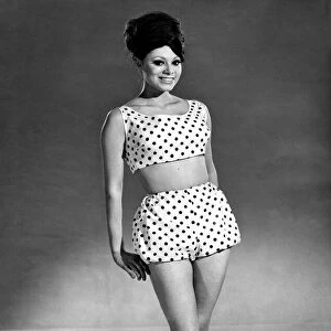 Reveille Fashions 1964: Carmen Dene modeling a two piece beach outfit. June 1964 P007574
