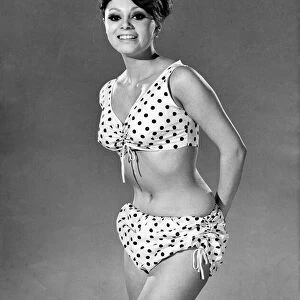 Reveille Fashions 1964: Carmen Dine modeling a polka dot bikini. June 1964 P007548