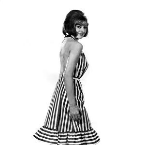 Reveille Fashions 1964: Margaret Loraine modeling a striped summer dress